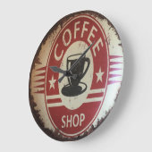 Muurklok met bord voor koffiewinkel met rood, zwar grote klok (Hoek)