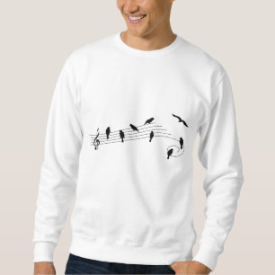 Muziekbalk met vogels als muzieknoten. trui