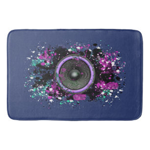 Muziekluidspreker en gesplatterde verf badmat