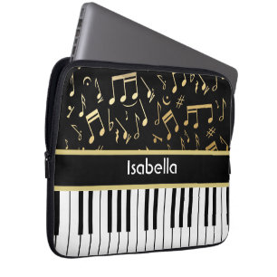 Muzieknoten en pianoketoetsen, zwart en goud laptop sleeve