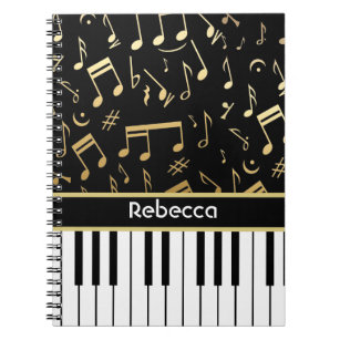 Muzieknoten en pianoketoetsen, zwart en goud notitieboek