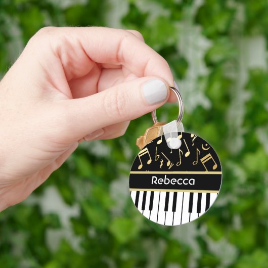Muzieknoten en pianoketoetsen, zwart en goud sleutelhanger (Hand)