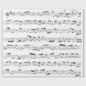 Muzieknoten over wit cadeaupapier (Vlak)