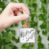 Muzieknoten over wit sleutelhanger (Hand)