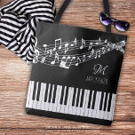 Muzieknoten Toetsenbordnaam Monogram Aangepaste kl Tote Bag<br><div class="desc">Gepersonaliseerde, aangepaste kleur canvas tas met een pianoklavier en muziekpersoneel met notities in uw keuze van afbeeldingen en achtergrondkleuren (weergegeven in wit op zwart) met een monogram of initialen en/of naam of andere tekst in uw keuze van letterstijlen en kleuren om creëer uw eigen aangepaste look. Het ontwerp wordt op...</div>