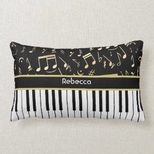 Muzieknotities en pianosleutels, zwart en goud kussen