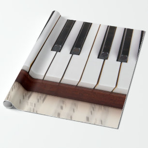 muzieknotities op de achtergrond van een pianoakoe cadeaupapier