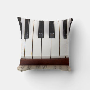 muzieknotities op de achtergrond van een pianoakoe kussen