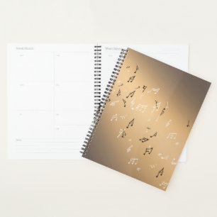 Muzikale noten in het gouden maanlicht planner