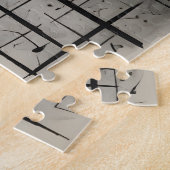 Muzikale noten op donkere houtskooltextuur legpuzzel (Zijkant)