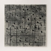 Muzikale noten op donkere houtskooltextuur legpuzzel (Horizontaal)