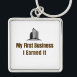 My First Business Keychain – I Earned It – Proud F<br><div class="desc">Celebrate the pride of launching your very first business! This keychain features the bold phrase "My First Business – I Earned It", perfect for anyone who worked hard to achieve this milestone. Whether it’s a startup, small business, or entrepreneurial venture, this keychain is a fun and meaningful reminder of dedication...</div>