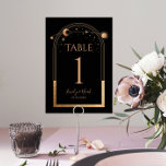 Mystical Black Gold Sun Moon Astronomy Weddenschap Kaart<br><div class="desc">Mystical Black Gold Sun Moon Astronomy Wedding Table Numbers zijn voorzien van gouden zon, maan en sterren met een gouden lijst op een zwarte achtergrond. Inside is je uitnodiging voor een aangepast huwelijk. Personaliseer door de tekst in de tekstvakjes uit te geven. Ontworpen voor u door de Nota van de...</div>