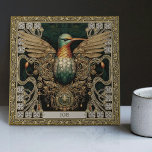 Mystieke kolibrie Tribal Jewel Tribute Tegeltje<br><div class="desc">Stap in een rijk waar de lichamelijke en spirituele samenkomen met onze zorgvuldig vervaardigde 'Mystical Hummingbird Tribal Jewel Ceramic Tegel'. Geïnspireerd door een samensmelting van unieke kunststijlen - tribale esthetiek, happycore optimisme, tapijt punk rebellie en symmetrische harmonie, resoneert deze tegel met een rijk visueel verhaal. Het kernmotief is voorzien van...</div>