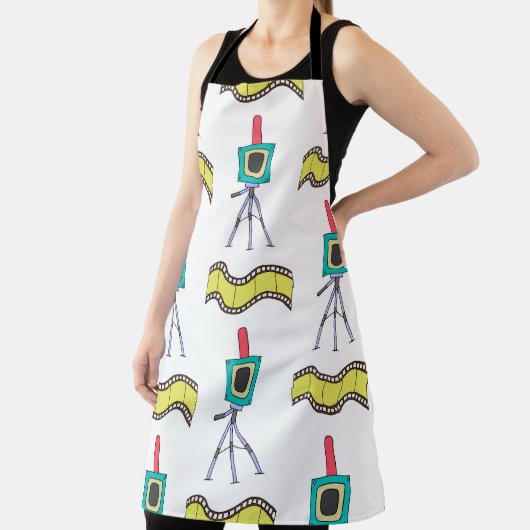 Naadloos patroon met camera's en filmstrips op een schort (Insitu)