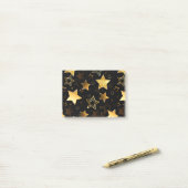 Naadloos patroon met gouden sterren post-it® notes (Op bureau)