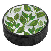 Naadloos patroon met groene theelbladeren hockey puck (3/4)