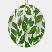 Naadloos patroon met groene theelbladeren keramisch ornament (Links)