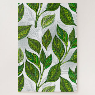 Naadloos patroon met groene theelbladeren legpuzzel