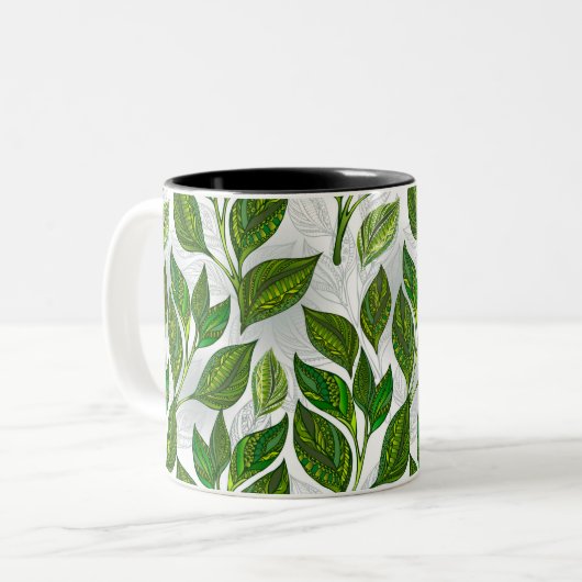 Naadloos patroon met groene theelbladeren tweekleurige koffiemok (Voorkant links)