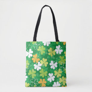 Naadloos patroon van verspreide klavers en shamroc tote bag