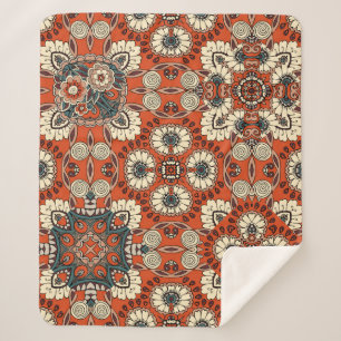 Naadloos sierpatroon met florale en paisle sherpa deken