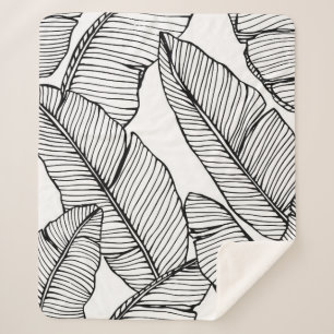 Naadloze bananenbladpatroon achtergrond. Zwart en Sherpa Deken