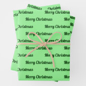 Naadloze prettige kerst Teksten over licht groen Inpakpapier Vel (In situ)