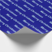 Naadloze prettige kerstteksten over blauw cadeaupapier (Hoek)