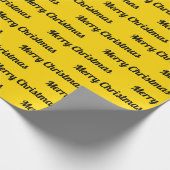 Naadloze prettige kerstteksten over geel cadeaupapier (Hoek)