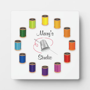 Naaigronden, naalden en draden fotoplaat