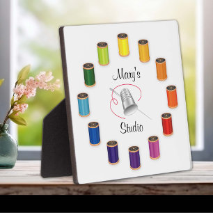 Naaigronden, naalden en draden fotoplaat