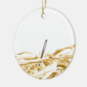 naald in een hooiberg keramisch ornament (Links)