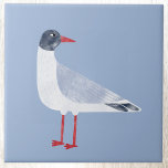Nautical Seagull Bird Sky Blue Tegeltje<br><div class="desc">Een leuke en brutale zwarte kopmeeuw die bij de oceaan staat. Ideaal voor wie houdt van de kust. Originele versie door Nic Squirrell.</div>
