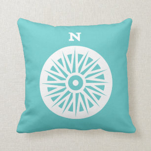 nautisch kompas wit op blauwgroen blauwe kussen
