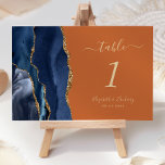 Navy Blue Gold Agaat verbrande Sinaasappel bruilof Kaart<br><div class="desc">De linkerkant van deze elegante moderne trouwtafel nummerkaart heeft een marineblauwe waterverf agaatrand afgewerkt met faux gouden glitter. De aanpasbare tekst combineert goudkleurig handschrift,  cursief en koperplaat lettertypen op een gebrande oranje achtergrond.</div>