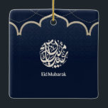 Navy Eid Mubarak Arabic Calligraphy Art Keramisch Ornament<br><div class="desc">An elegant Islamic design featuring intricate Arabic calligraphy set within a refined circular emblem on a deep navy patterned background. A graceful mosque-inspired arch and delicate dotted details add a traditional architectural touch, while the clean “Eid Mubarak” typography completes the celebratory message. The contrast of rich blue and soft beige...</div>