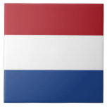 Nederlandse vlag Tile Tegeltje<br><div class="desc">Voeg een vleugje Nederlandse elegantie toe aan uw interieur met onze exclusieve tegel met de vlag van Nederland! Deze tegel is met veel aandacht voor detail gemaakt en is meer dan alleen een decoratief stuk; het is een eerbetoon aan het Nederlandse erfgoed en de culturele trots. Het verbluffende ontwerp toont...</div>