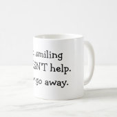 Nee, glimlachen helpt niet. koffiemok (Voorkant rechts)