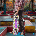 Neon Graffiti met Paarse 'Live to Ride' Motto Persoonlijk Skateboard<br><div class="desc">Dit skateboarddek barst van levendige kleuren, met neon spatten van roze, geel, blauw en groen tegen een witte achtergrond. In het midden valt het gedurfde paarse motto "Live to Ride" op, dat perfect de vrijgevochten en energieke sfeer van de cultuur van het schaats vastlegt. Het op graffiti geïnspireerde ontwerp, met...</div>