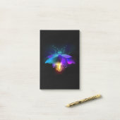 Neon vuurvlieg op zwart post-it® notes (Op bureau)