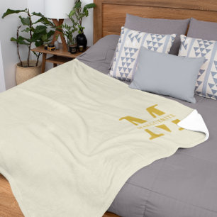 Neutraal beige goud monogram fleece deken