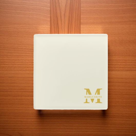 Neutraal beige goud monogram glazen onderzetter