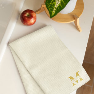 Neutraal beige goud monogram theedoek