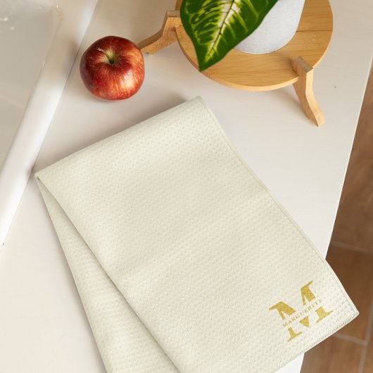 Neutraal beige goud monogram theedoek
