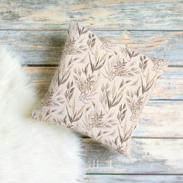 Neutraal botanisch bladerenpatroon in warm beige kussen