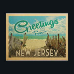 New Jersey Shore Postcard Beach Vintage Travel Briefkaart<br><div class="desc">This Greetings From New Jersey vintage postcard design features a sandy beach with a beautiful turquoise ocean water and above the sea,  a blue sky with billowy white clouds. In vintage travels style.</div>