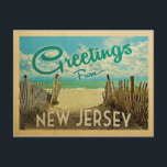 New Jersey Shore Postcard Beach Vintage Travel Briefkaart<br><div class="desc">This Greetings From New Jersey vintage postcard design features a sandy beach with a beautiful turquoise ocean water and above the sea,  a blue sky with billowy white clouds. In vintage travels style.</div>