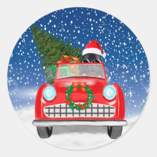 Newfoundland-hond rijdt auto in sneeuw met Kerstmi Ronde Sticker