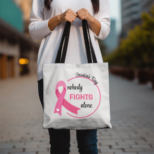 Niemand vecht alleen roze lint tote bag